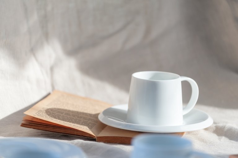 Cup of coffee and a book