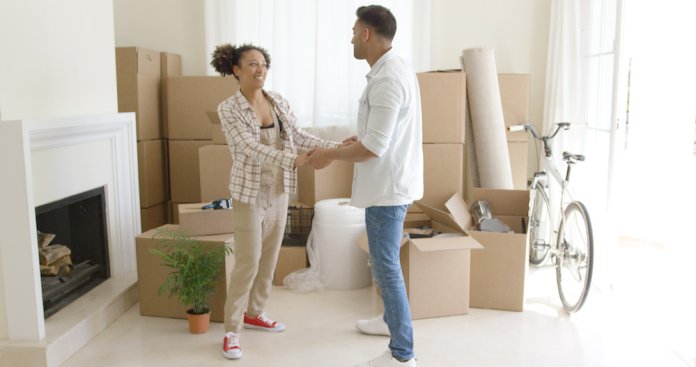 Young couple moving into a new house