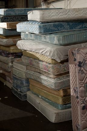 Discarded mattresses ready for recycling