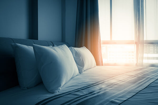 sunrise-on-bed-with-pillows