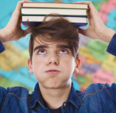 teenager holding books homework