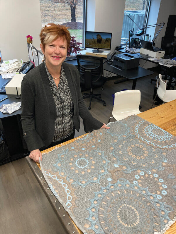 Creative Vice President of Design and Marketing Camilla Franklin shows off a new pile fabric for an added textural look.