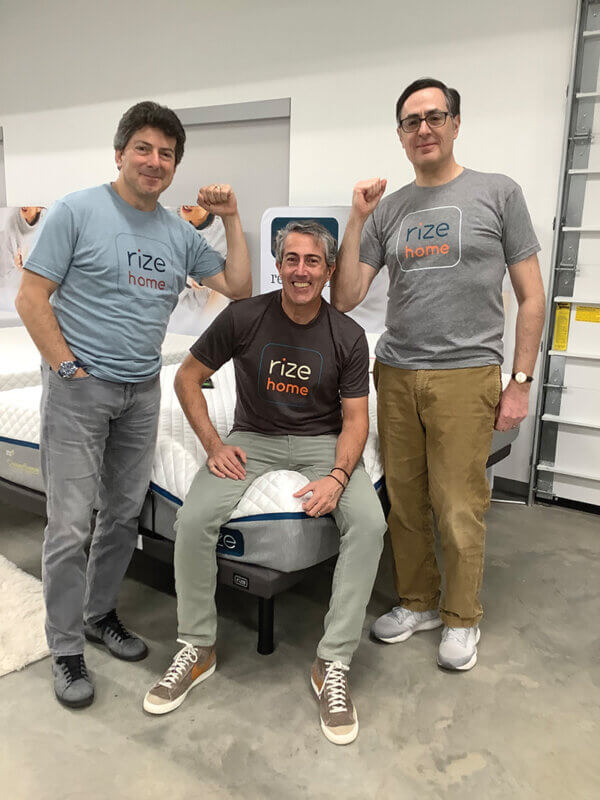 Rize Home CEO David Jaffe, seated, provides strong shoulders for company President Marc Spector, left, and Chief Financial Officer Zev Fredman to lean on — sometimes literally.