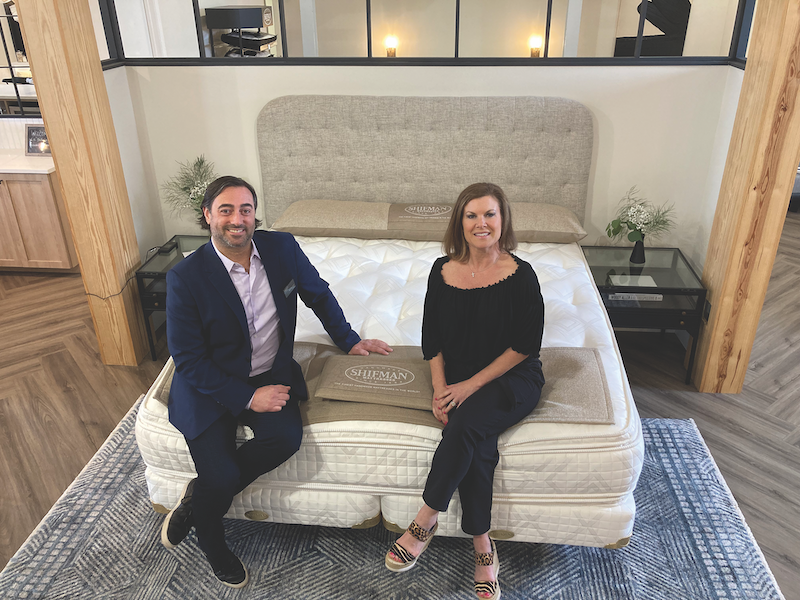 NEW DIRECTIONS Bill Hammer, president of Shifman Mattress Co., and Alison Minella, marketing director, showcase the Inspired collection at the company’s showroom in High Point along with their new design trade program.