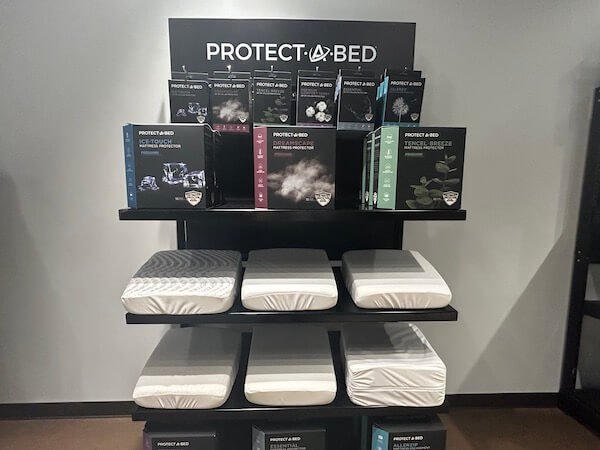 Summer 2023 Mattress Market. Protect-A-Bed showcased pillows, sheets and its newly streamlined lineup of mattress protectors.