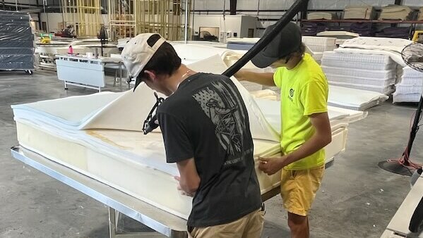 Compass Sleep Products provides foster children with the opportunity to learn how to build mattress foundations, among other skills.
