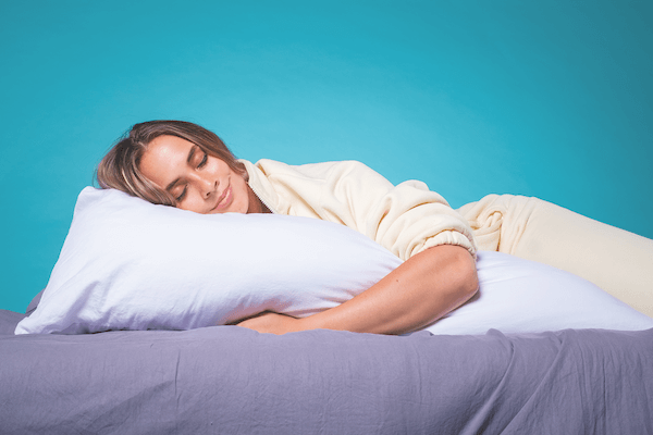 BEST OF BOTH The Shloof body pillow incorporates the features of a weighted blanket for soothing pressure and the rectangular shape aids spinal alignment.