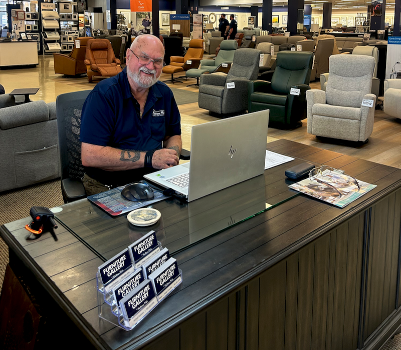 FRIENDLY FACE J.R. Shambaugh gives shoppers a friendly greeting when they step inside.