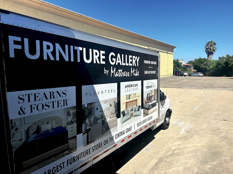 LOAD UP In the back of the store, a delivery truck parked at the loading dock is ready to haul away used mattresses as part of the MRC recycling program. 