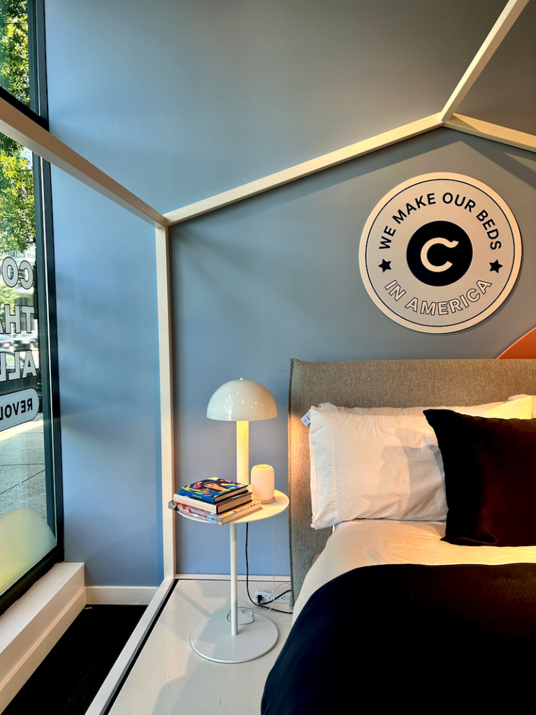 Casper retail innovation. Natural light floods the H Street store. In the window, a bedroom-like display includes one of the brand’s mattresses and to the side, a Casper Glow night light.