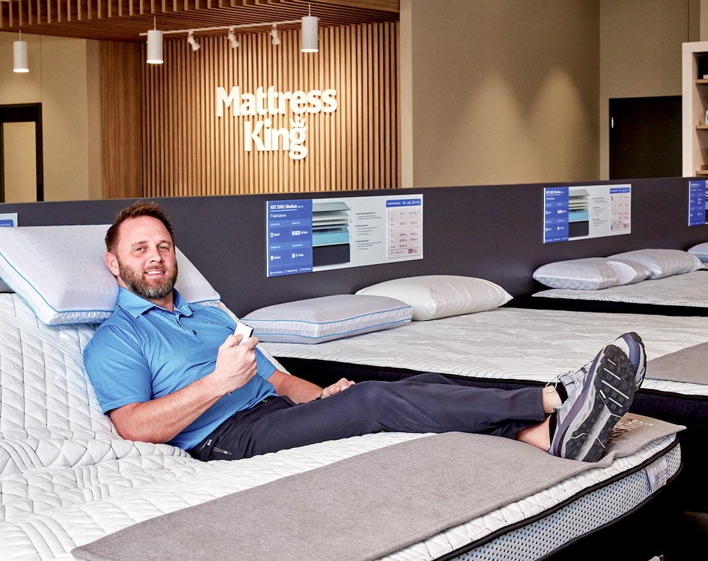 Ryan Farris, CEO and founder of Mattress King, demonstrates an adjustable base inside one of his stores in Oklahoma.