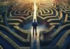 A man standing in the center of a complex maze