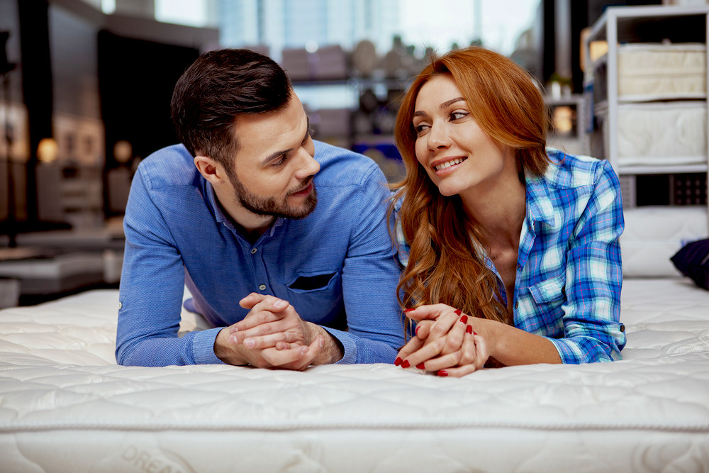 man and woman on mattress