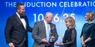 Former Carpenter CEO Inducted Into Hall of Fame Brad Beauchamp, president and CEO of Carpenter Co., second from left, receives an award on behalf of Stanley F. Pauley, who was inducted into the American Home Furnishings Hall of Fame Oct. 26.